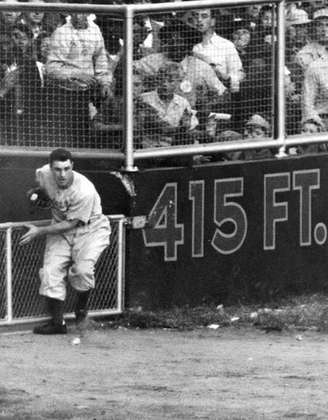 Al Gionfriddo of the Brooklyn Dodgers makes a game-saving catch against Joe DiMaggio of the New York Yankees in the sixth game of the World Series - This Day In Baseball